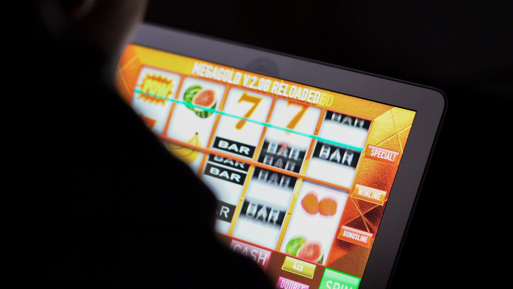 Gambling,Addicted,Man,In,Front,Of,Online,Casino,Slot,Machine
